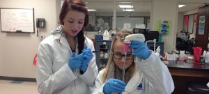 Biomedical students looking at samples