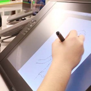 Close up of student drawing on a tablet