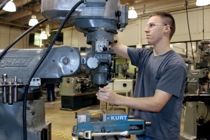 Student working on a manual lathe