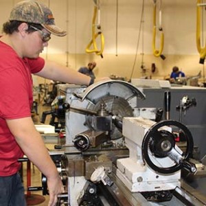 Student working on a a manual lathe