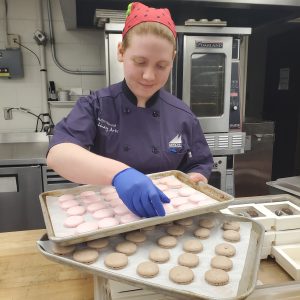 Jazlyn Hancock prepares macrons and chocolates.