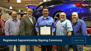 Registered Apprenticeship signing ceremony photo with link to full article.
