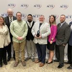 members of usic and meridian pose for partners in progress award